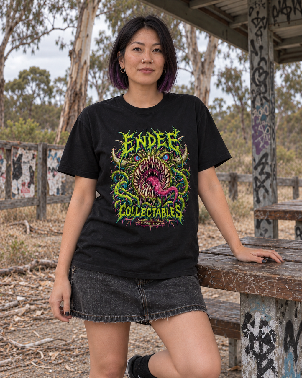 Thorn Maw — Graphic Tee in black — varied natural head pose, AI-generated model mockup