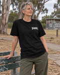 Signature — Longer Fit Tee in black — varied natural head pose, AI-generated model mockup