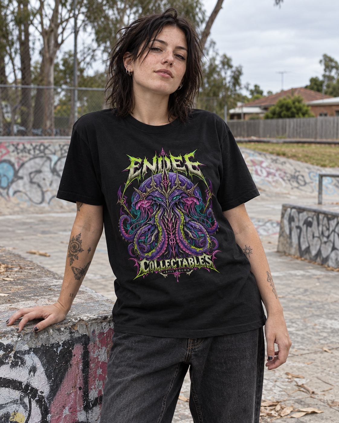 Abyss Crown black graphic tee on alternative adult woman at suburban Australian-style skatepark — AI-generated model mockup